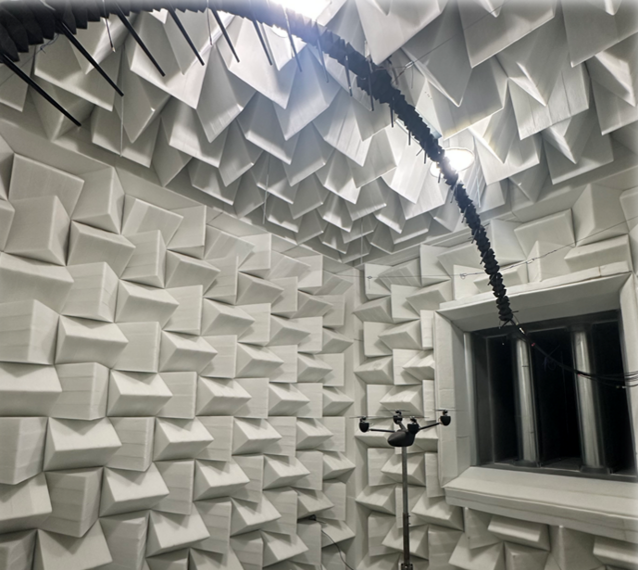 Four-rotor drone model inside the Anechoic Wind Tunnel